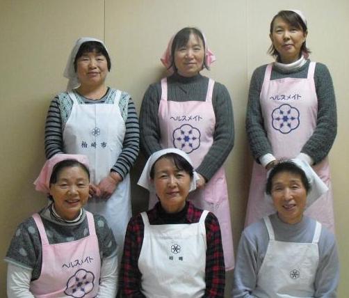 三角巾とエプロンをした女性6名の食生活改善推進員の写真
